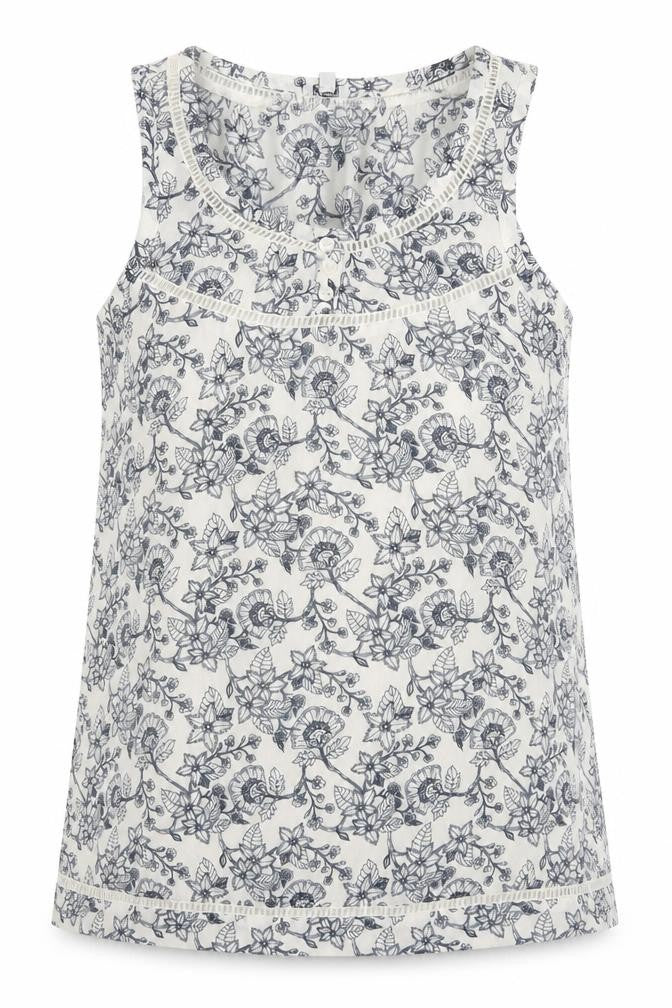 Front view of kismel women’s white floral basic tank, size XS