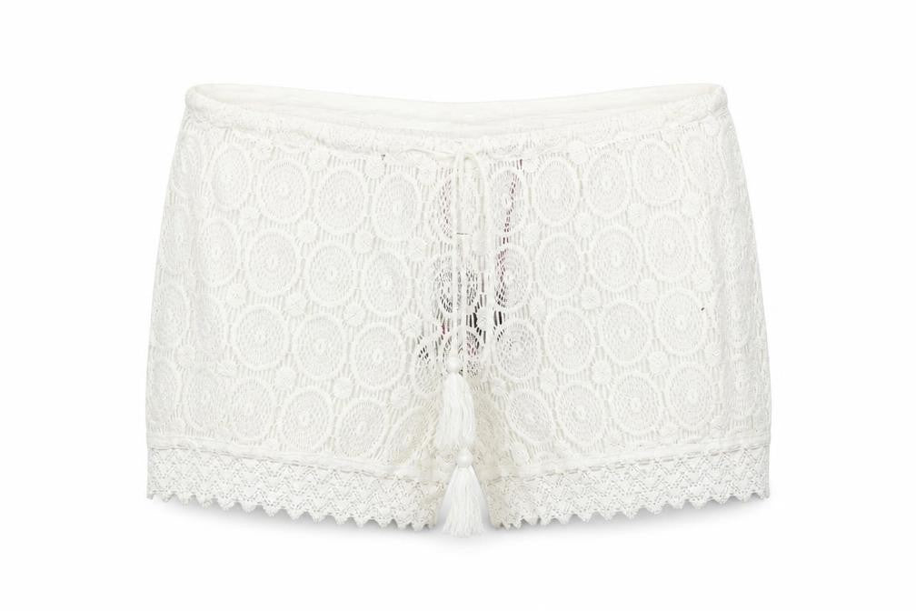 Front view of Boohoo women’s white cut-off shorts, size UK 12