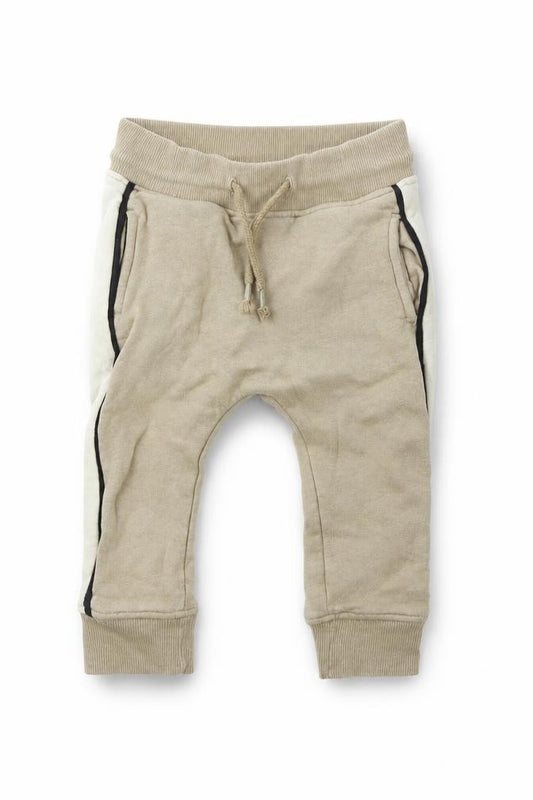 Front view of Next girls’ beige jogger trousers, size 12-18, months