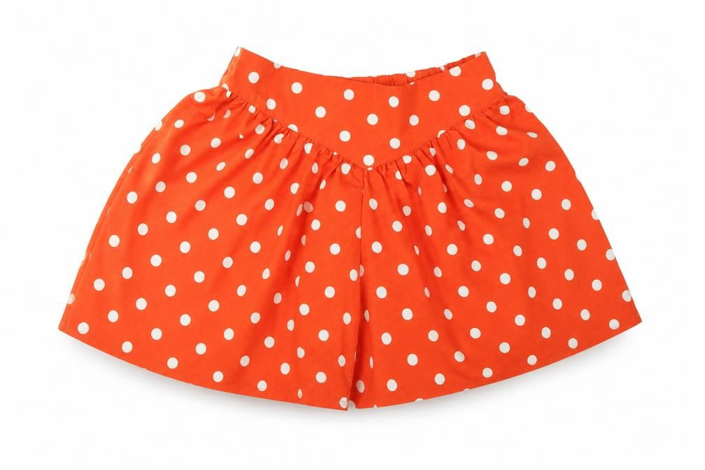 Front view of Next girls’ orange polka dot bermuda shorts, size 6, years