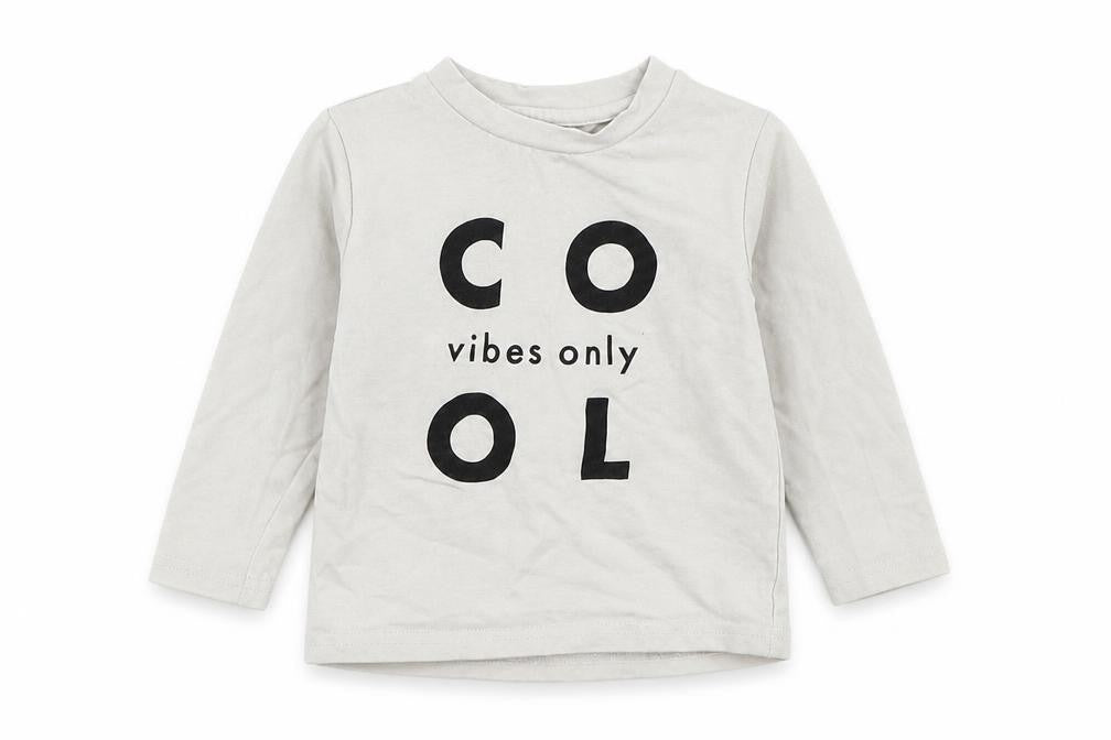 Front view of Tiny Tribe Baby White Basic T-Shirt, size 12, Months - cool vibes only
