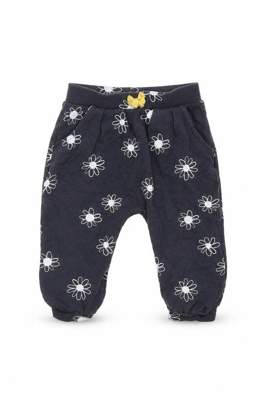 Front view of Nutmeg girls’ grey floral jogger trousers, size 6-9, months