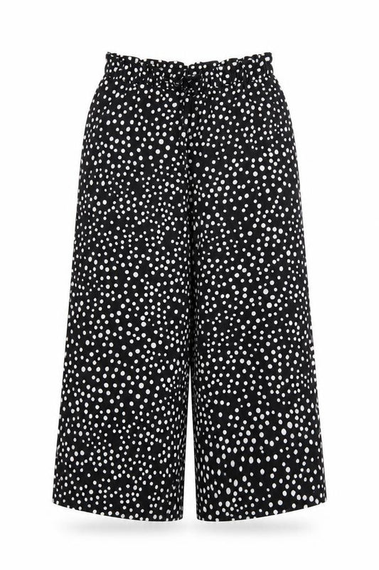 Front view of VERY girls’ black polka dot jogger trousers, size 9, years