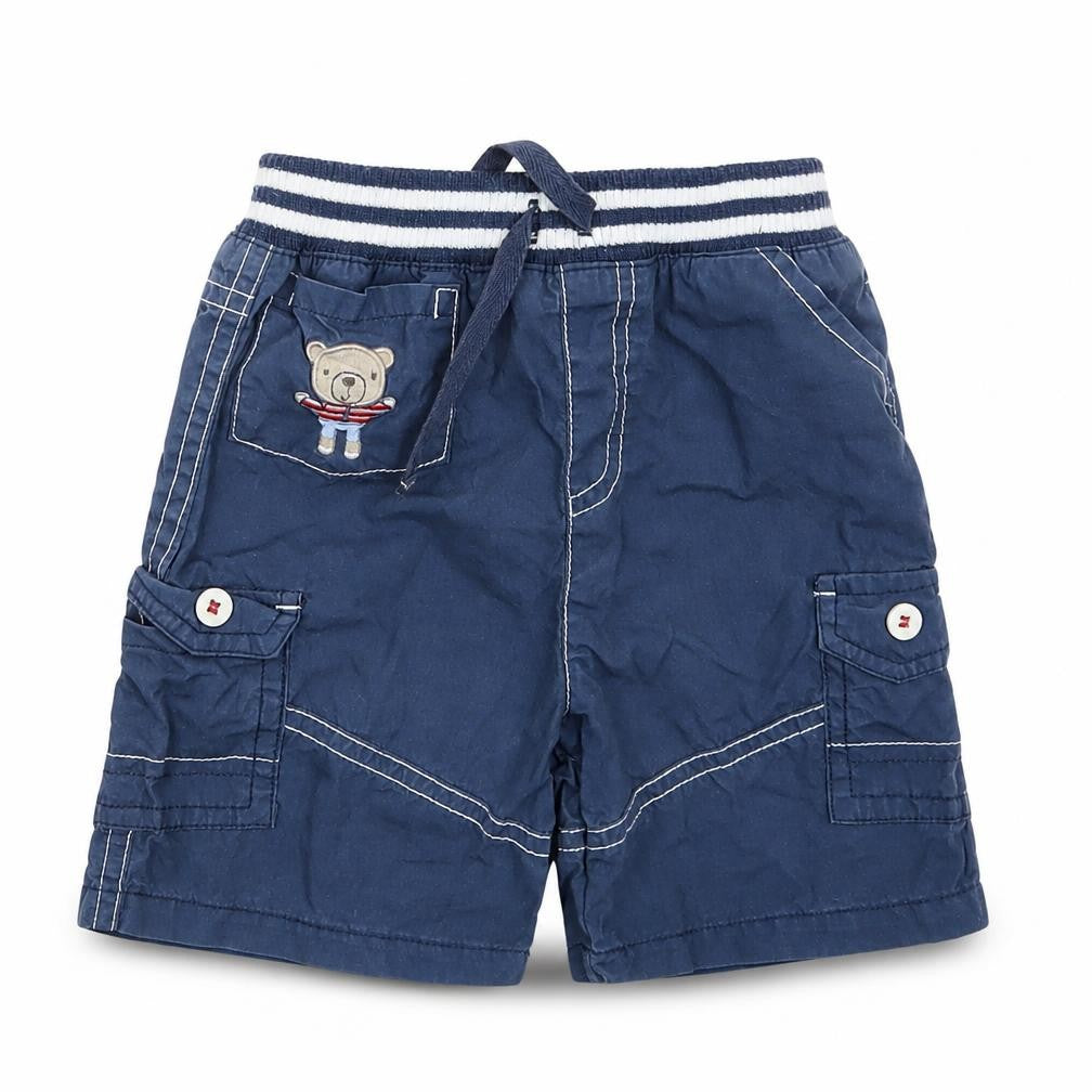 Front view of Tu boys’ blue cropped trousers, size 9-12, months
