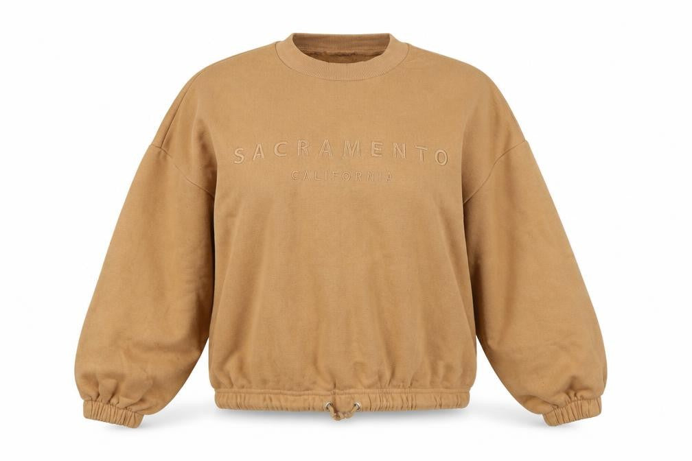 Front view of Primark women’s orange pullover sweatshirt, size S