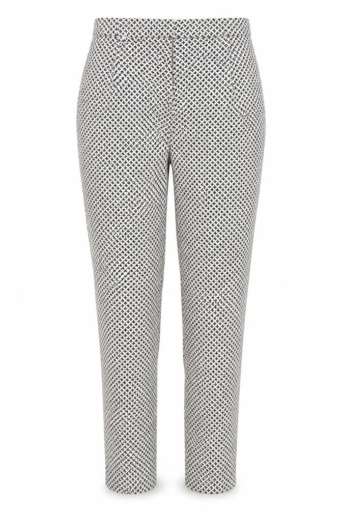 Front view of H&M women’s white polka dot trousers, size UK 8, 27-inch leg