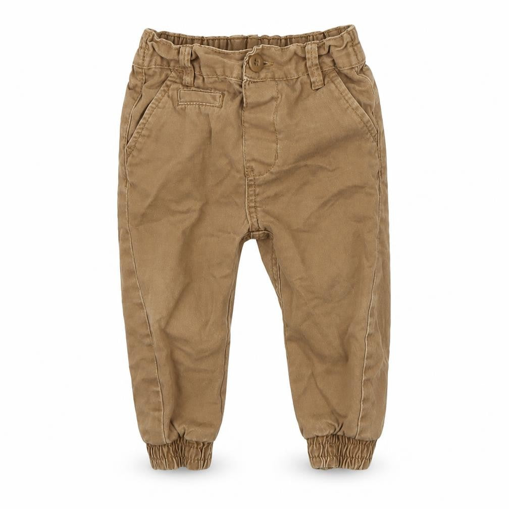 Front view of early boys’ brown cargo trousers, size 12-18, months