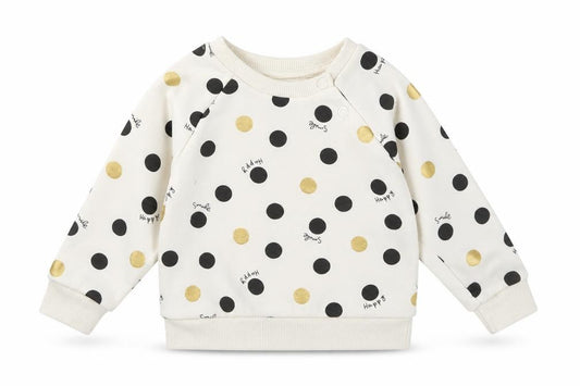 Front view of Primark girls’ ivory polka dot jumper, size 6-9, months