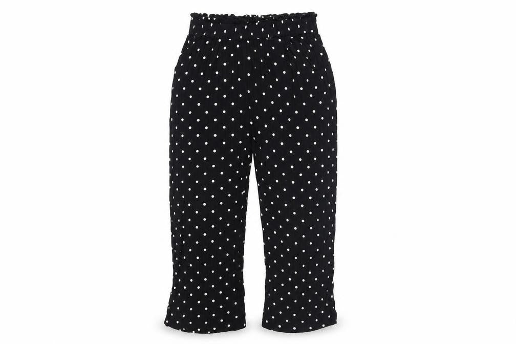 Front view of Next girls’ black polka dot cropped trousers, size 9, years