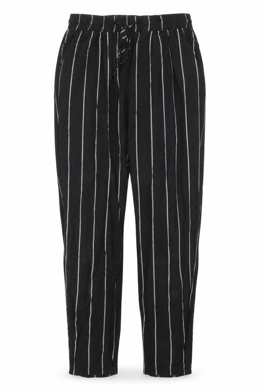 Front view of PRETTYLITTLETHING women’s black striped harem trousers, size UK 8, 23-inch leg