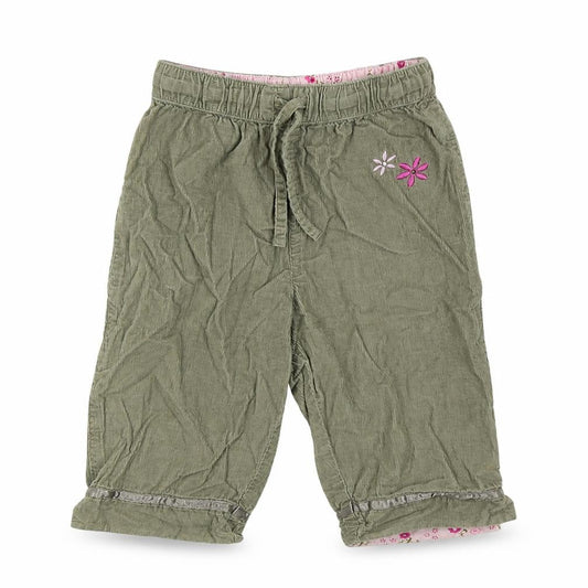 Front view of H&S girls’ green colourblock jogger trousers, size 6-9, months