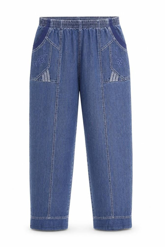 Front view of women’s blue denim mom jeans, size UK 28, in, 26-inch leg
