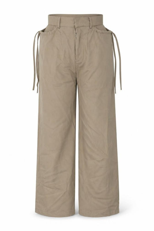 Front view of Preworn women’s brown trousers, size UK 26, in, 27-inch leg - cut out sides