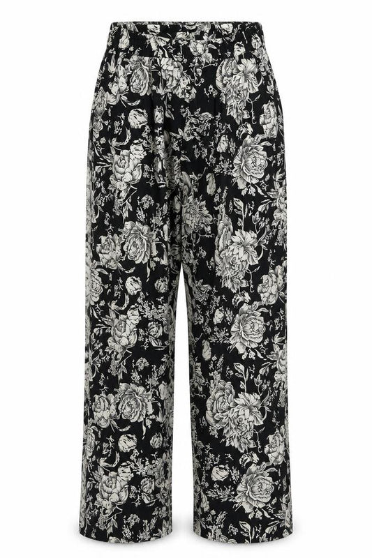 Front view of The Gud Look women’s black floral trousers, size UK 4, 29-inch leg