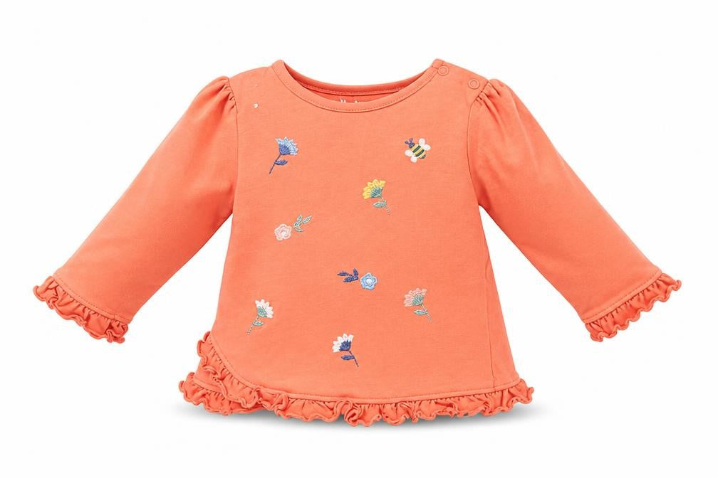 Front view of Nutmeg girls’ orange floral basic t-shirt, size 6-9, months