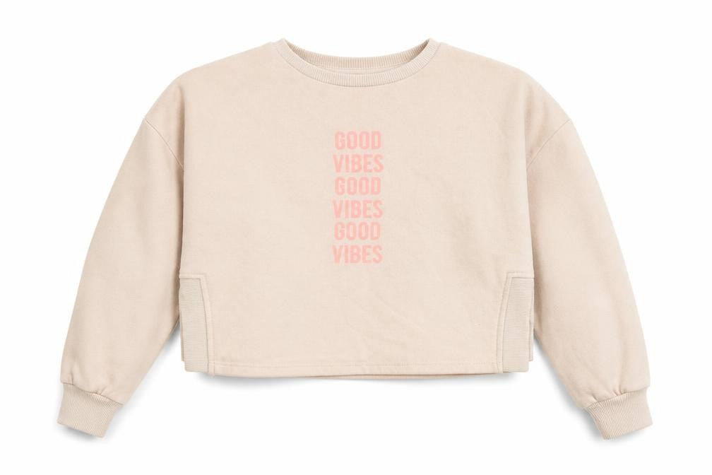 Front view of Primark girls’ beige pullover sweatshirt, size 12-13, years