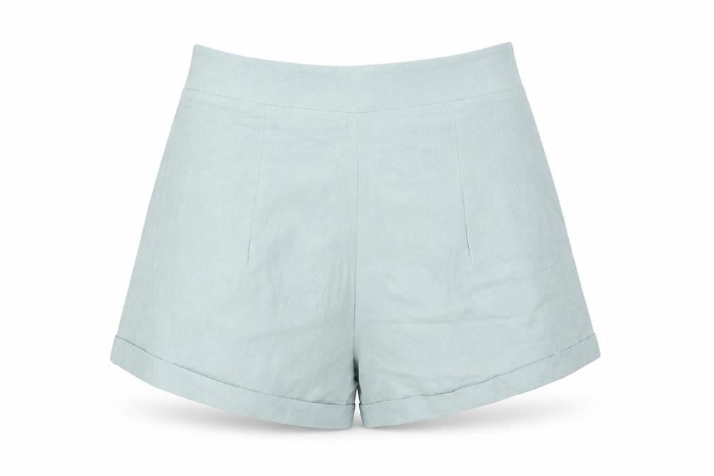 Front view of SHEIN women’s green cut-off shorts, size M
