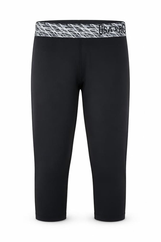 Front view of USA Pro girls’ black jegging trousers, size 7-8, years