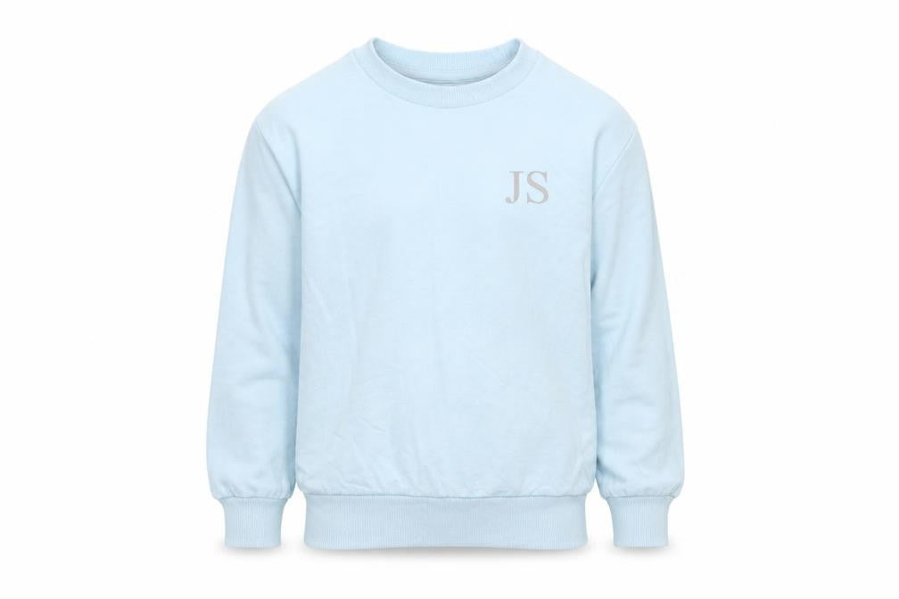 Front view of Studio girls’ blue pullover sweatshirt, size 5-6, years