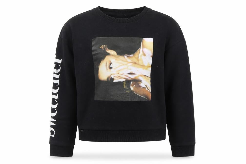 Front view of Primark girls’ black jumper, size 9, years
