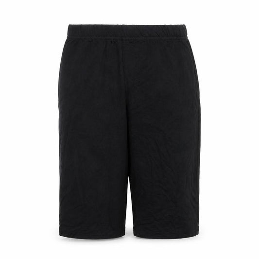 Front view of PRETTYLITTLETHING women’s black biker shorts, size UK 4