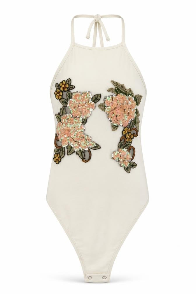 Front view of PRETTYLITTLETHING women’s white floral bodysuit one-piece, size UK 4