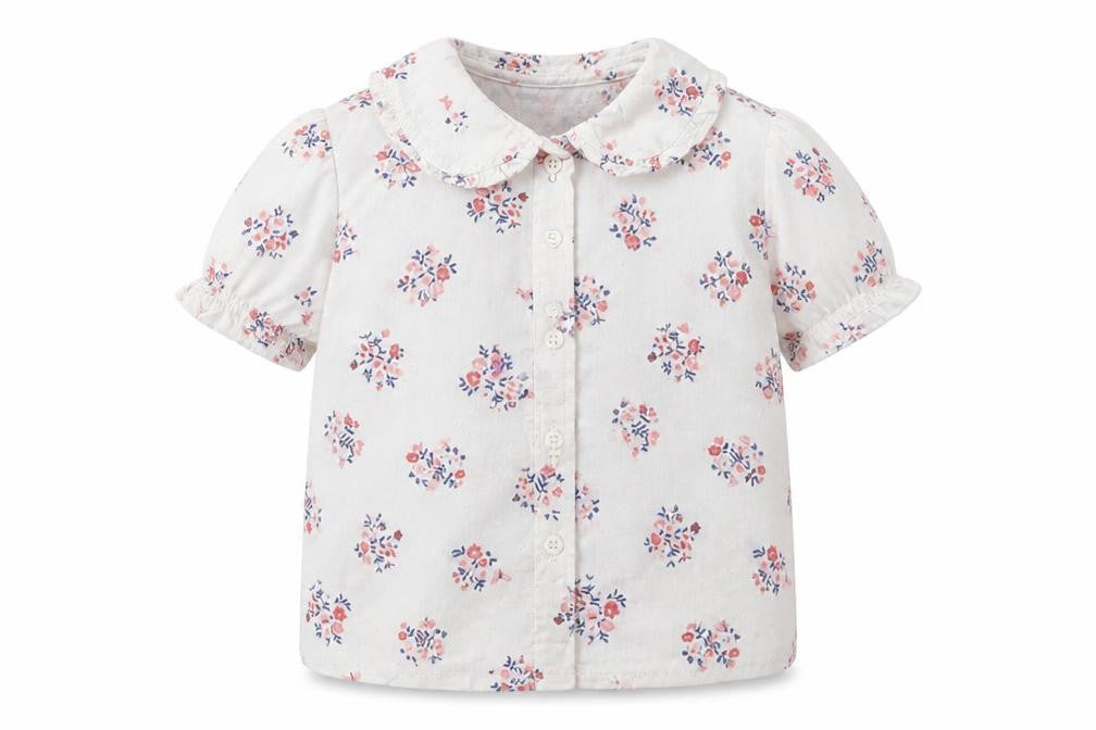 Front view of Nutmeg girls’ white floral basic button-up, size 18-24, months