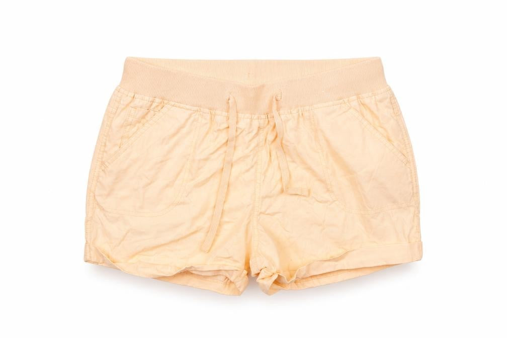 Front view of Atmosphere women’s orange paperbag shorts, size UK 10