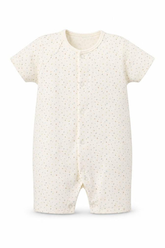 Front view of George girls’ beige spotted romper one-piece, size 9-12, months
