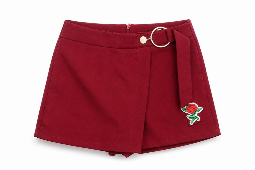 Front view of L & M women’s red hot pants shorts, size UK 28, in