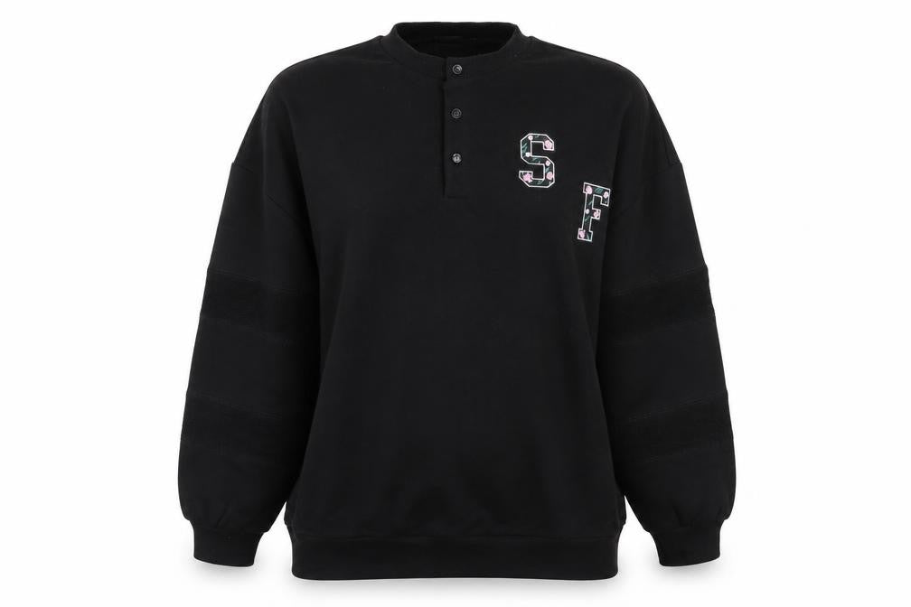 Front view of stuffle women’s black floral jumper, size UK 10