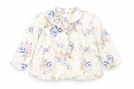 Front view of Nutmeg girls’ white floral basic button-up, size 12, months