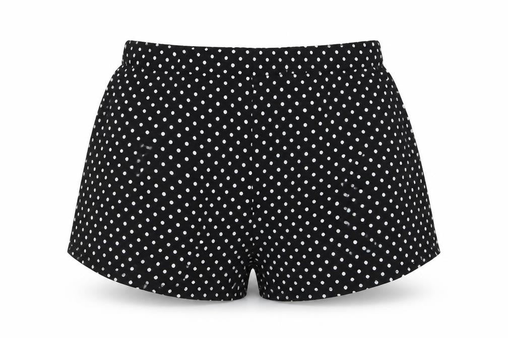 Front view of PRETTYLITTLETHING women’s black polka dot hot pants shorts, size UK 12
