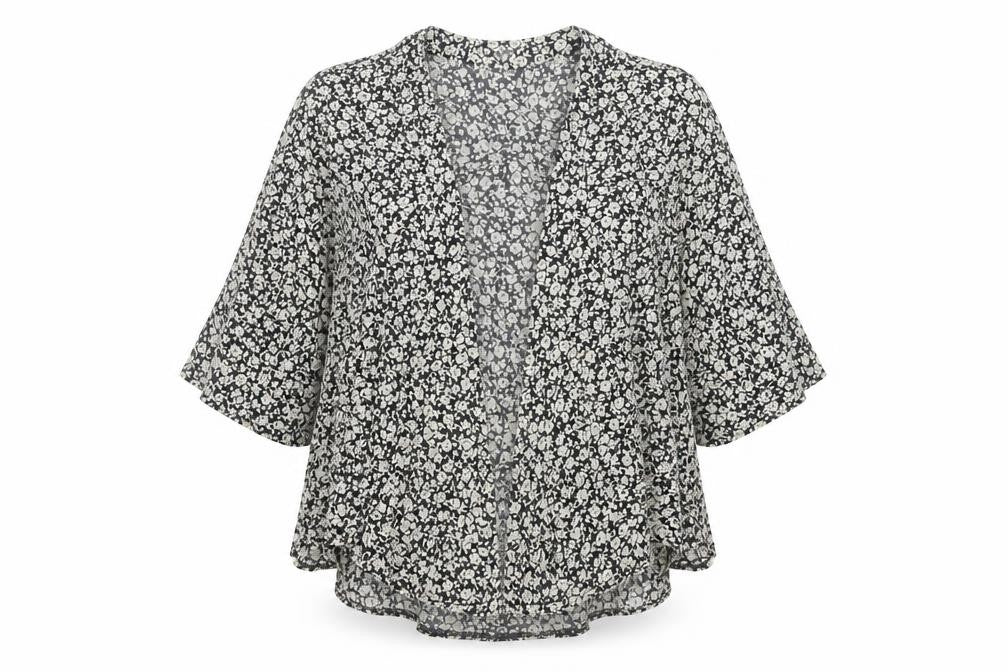 Front view of internationale women’s black floral viscose basic blouse, size UK 10, v-neck