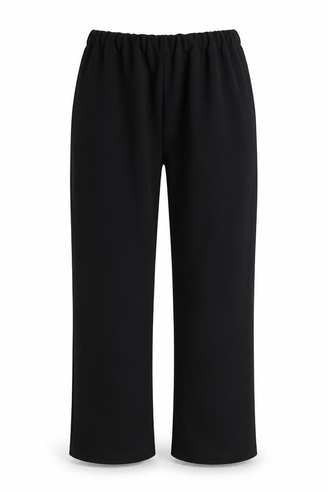 Front view of Preworn women’s black polyester trousers, size UK 30, in, 26-inch leg regular
