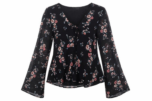 Front view of H&M women’s black floral polyester basic blouse, size UK 6, v-neck