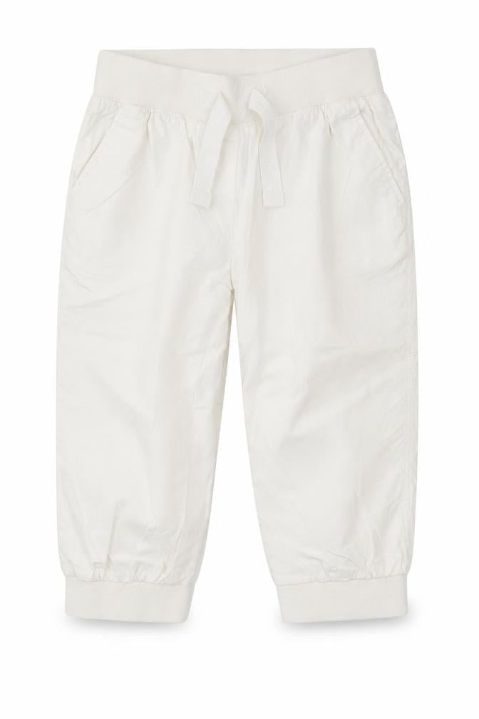 Front view of Next girls’ white cotton chino trousers, size 9, years regular drawstring