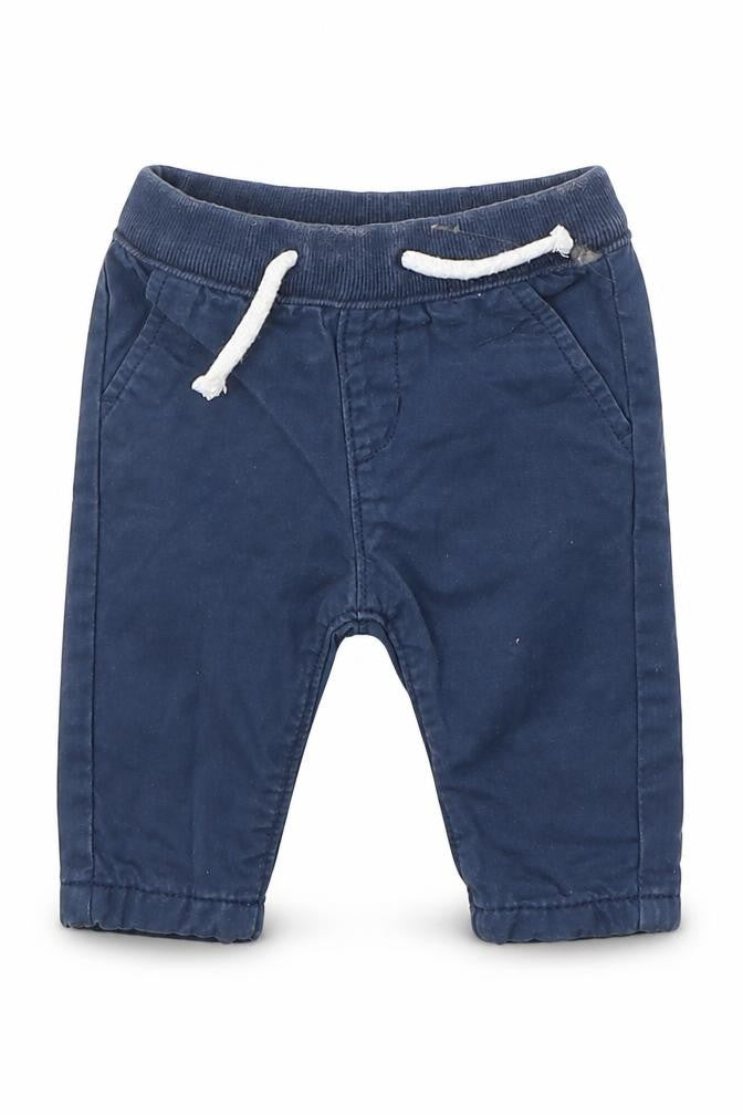Front view of Next boys’ blue cotton capri trousers, size 0-3, months pullover