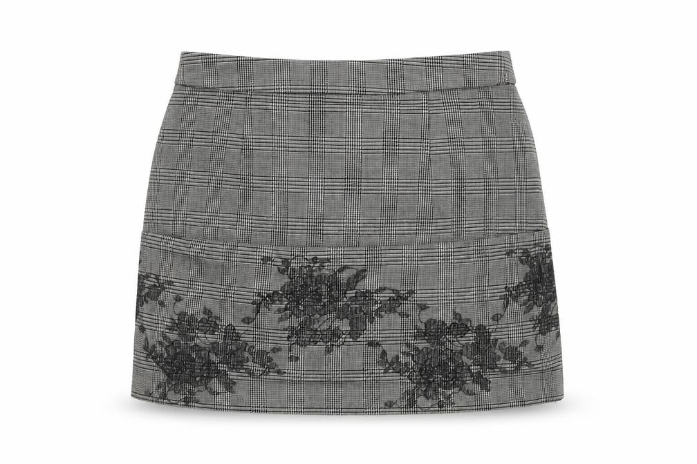 Front view of Preworn women’s grey check polyester mini skirt, size UK 28, in zip