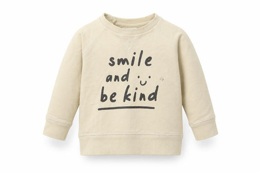 Front view of Next girls’ beige cotton jumper, size 6-9, months