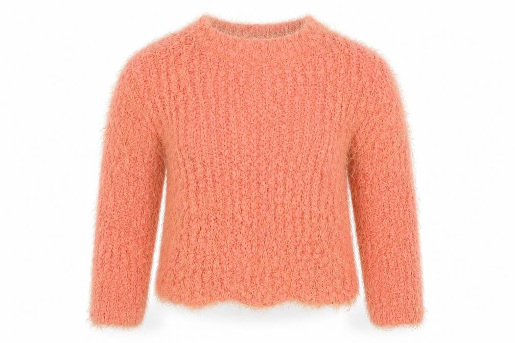 Front view of Dunnes girls’ orange round neck polyester jumper, size 5, years