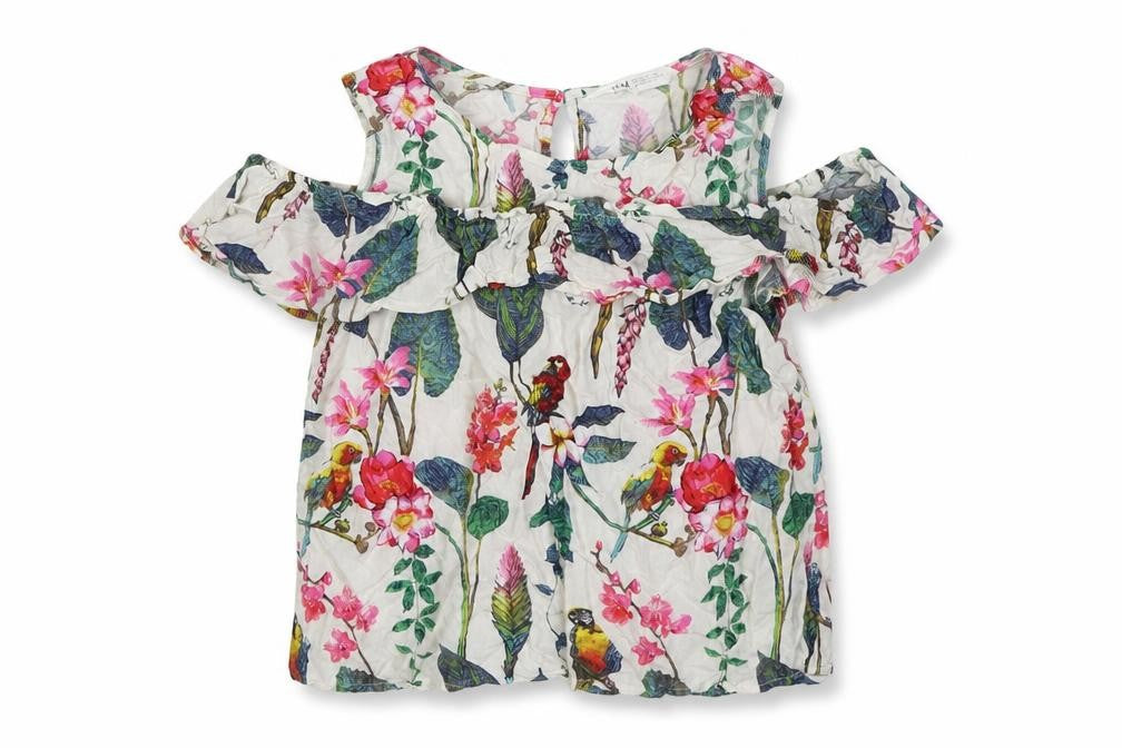Front view of H&M girls’ white floral viscose basic blouse, size 12, years round neck pullover