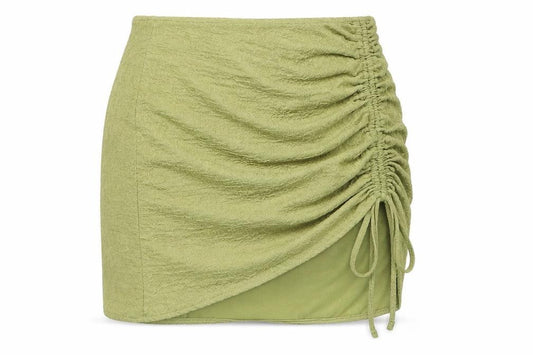 Front view of PRETTYLITTLETHING women’s green polyester mini skirt, size UK 8
