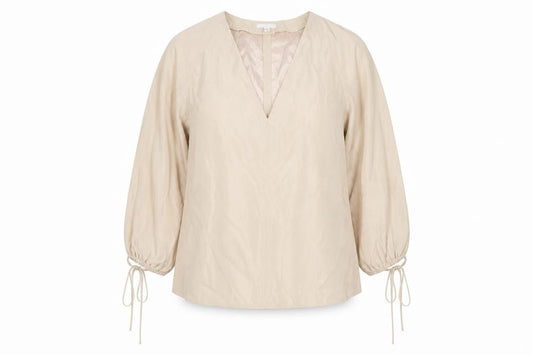 Front view of H&M women’s beige polyester basic blouse, size L, v-neck