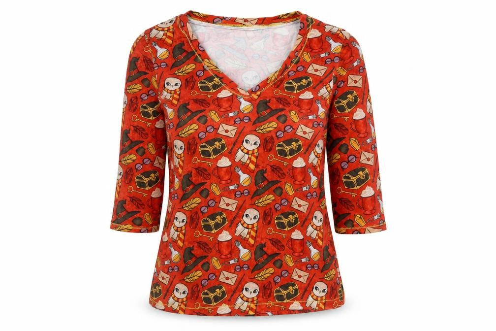Front view of Preworn women’s orange geometric polyester basic polo, size UK 10, v-neck - harry potter