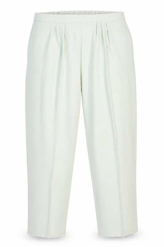 Front view of Preworn women’s green polyester carrot trousers, size UK 24, 29-inch leg regular