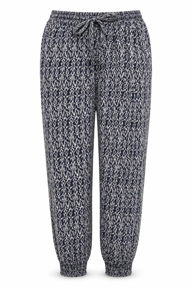 Front view of Quiz women’s black geometric viscose trousers, size UK 10, 27-inch leg regular drawstring