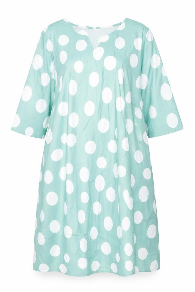 Front view of women’s green polka dot polyester a-line, size 2XL, v-neck pullover