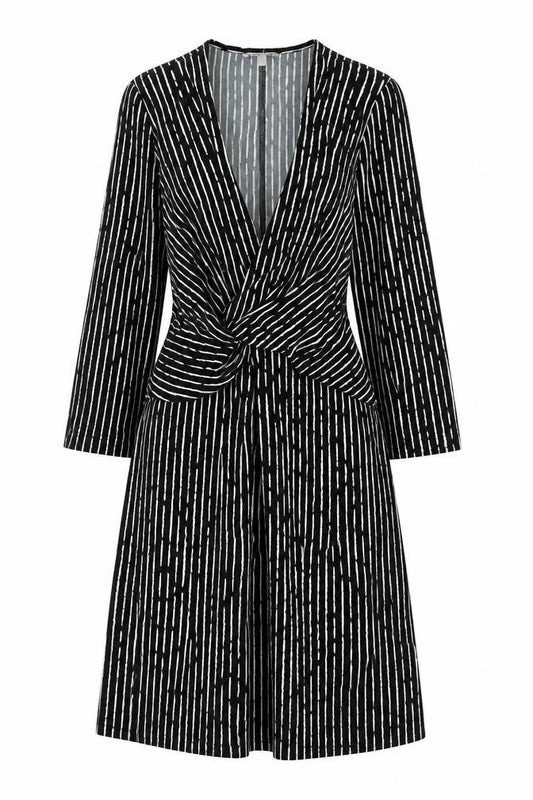 Front view of Nutmeg women’s black geometric polyester a-line, size UK 10, v-neck pullover
