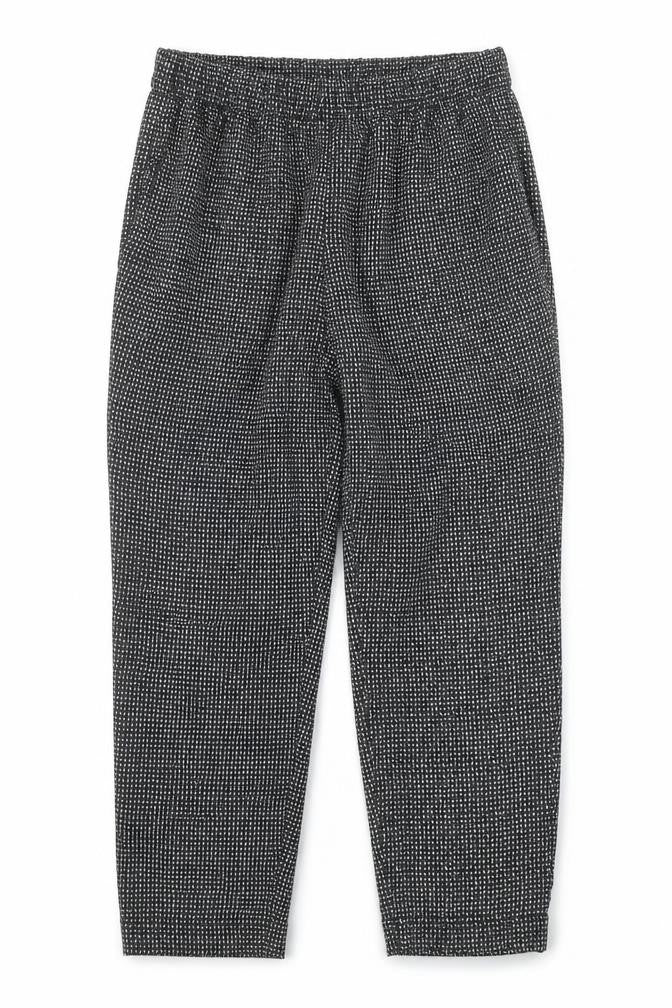 Front view of H&M women’s black geometric polyester jogger trousers, size UK 10, regular